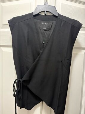 Balboa Black Sleeveless Wrap Top and cargo pants can cinch the bottom ankle